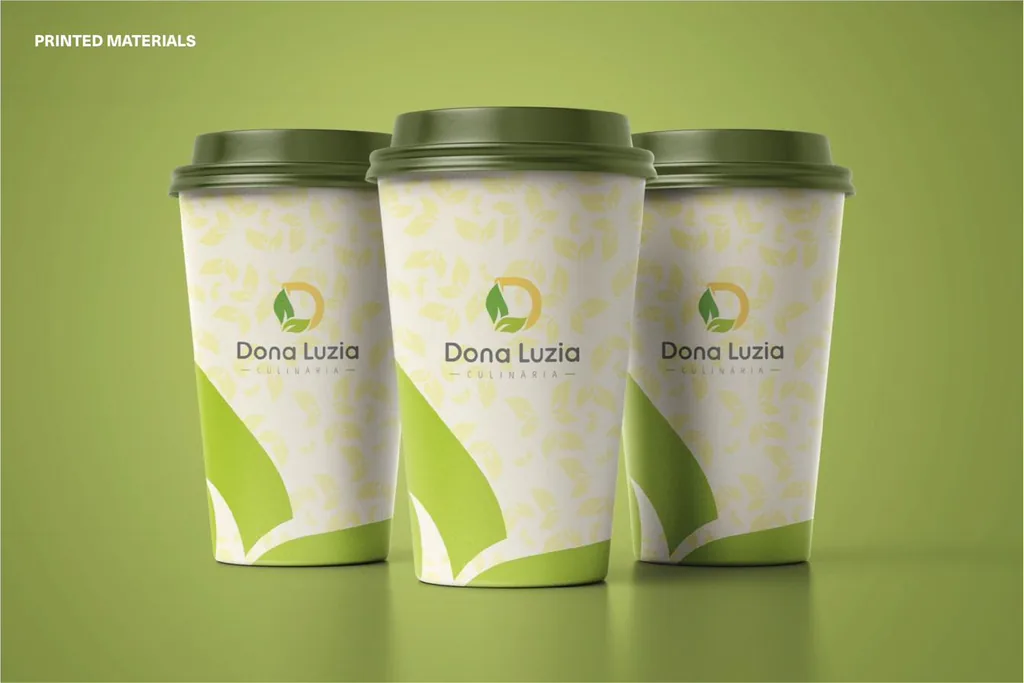 Printed materials: Dona Luzia coffee cups with a leaf pattern