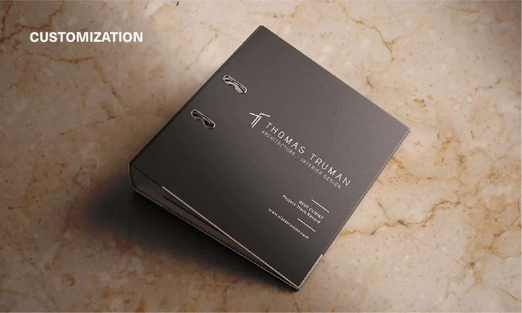 Customization: dark binder embossed with the Thomas Truman logo on marble