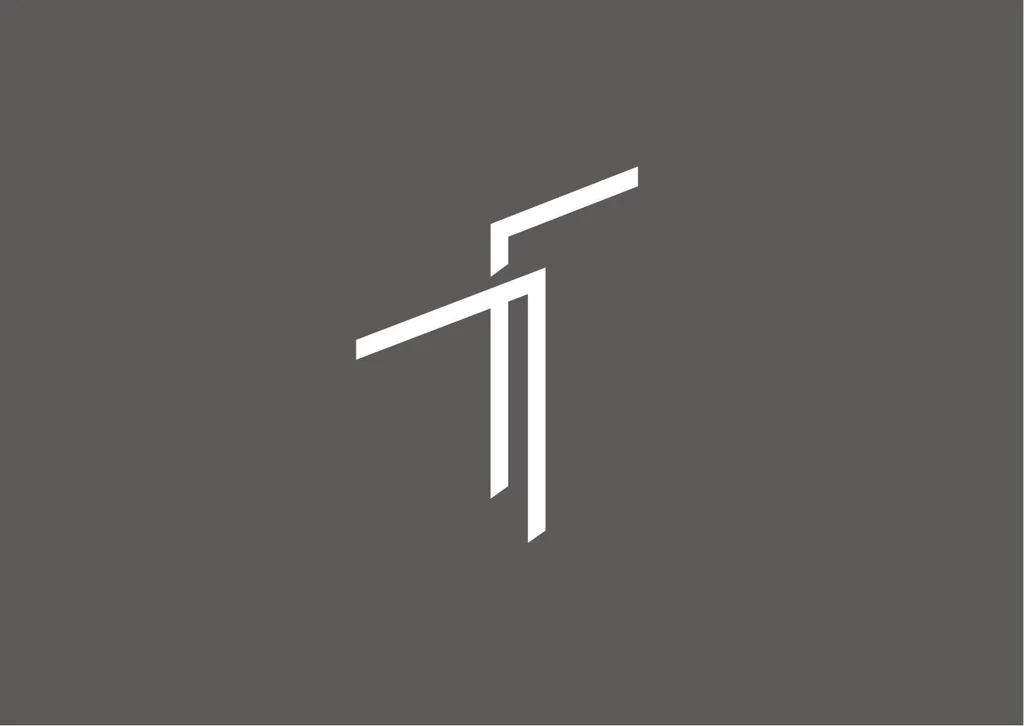 Thomas Truman T monogram in white on gray