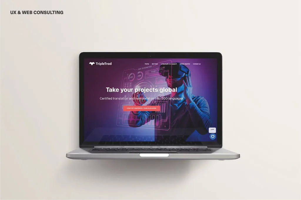 TripleTrad website homepage, “Take your projects global,” shown on a laptop